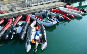 people smuggler boats piled against berth