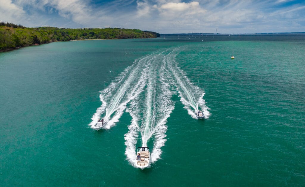 Freedom Boat Club three boats with wake