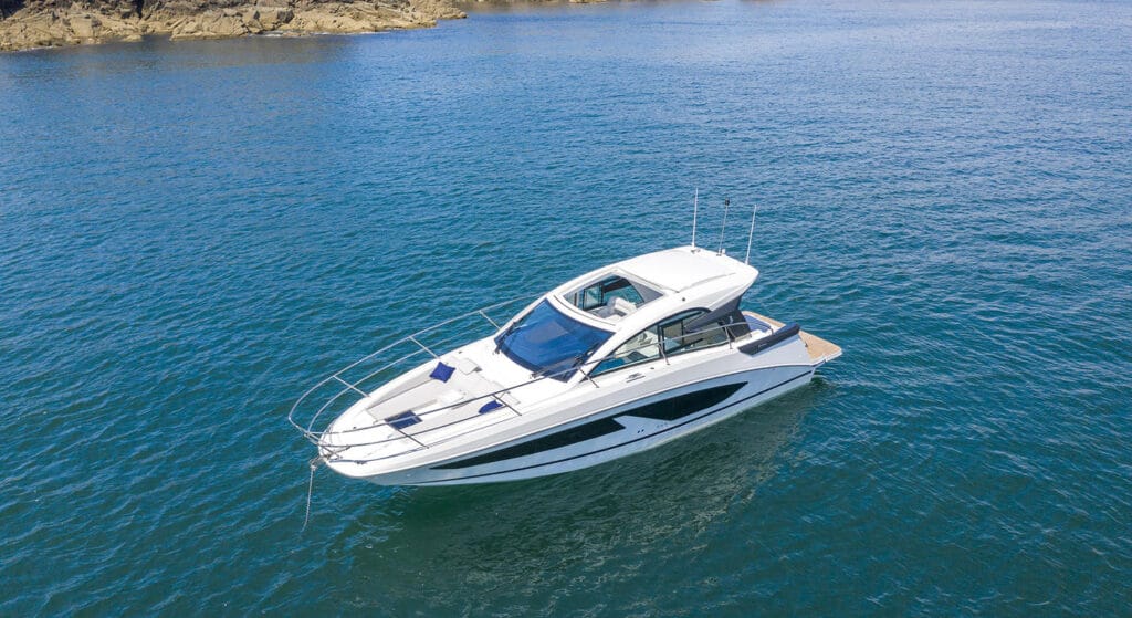 Birds eye view Beneteau motorboat anchored