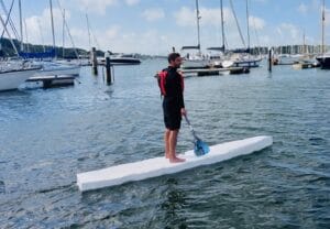 man on recycled paddleboard