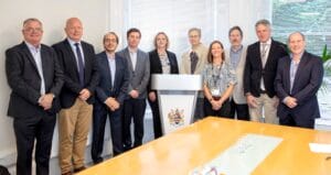 Group of ten people from BMT and the University of Plymouth standing in a row having signed the Memorandum of Understanding.