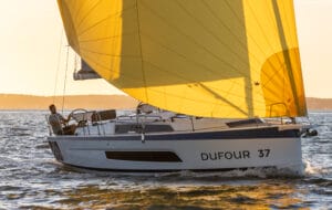 Dufour Yachts white sailing yacht with yellow headsail