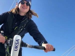 Woman on boat against blue sky