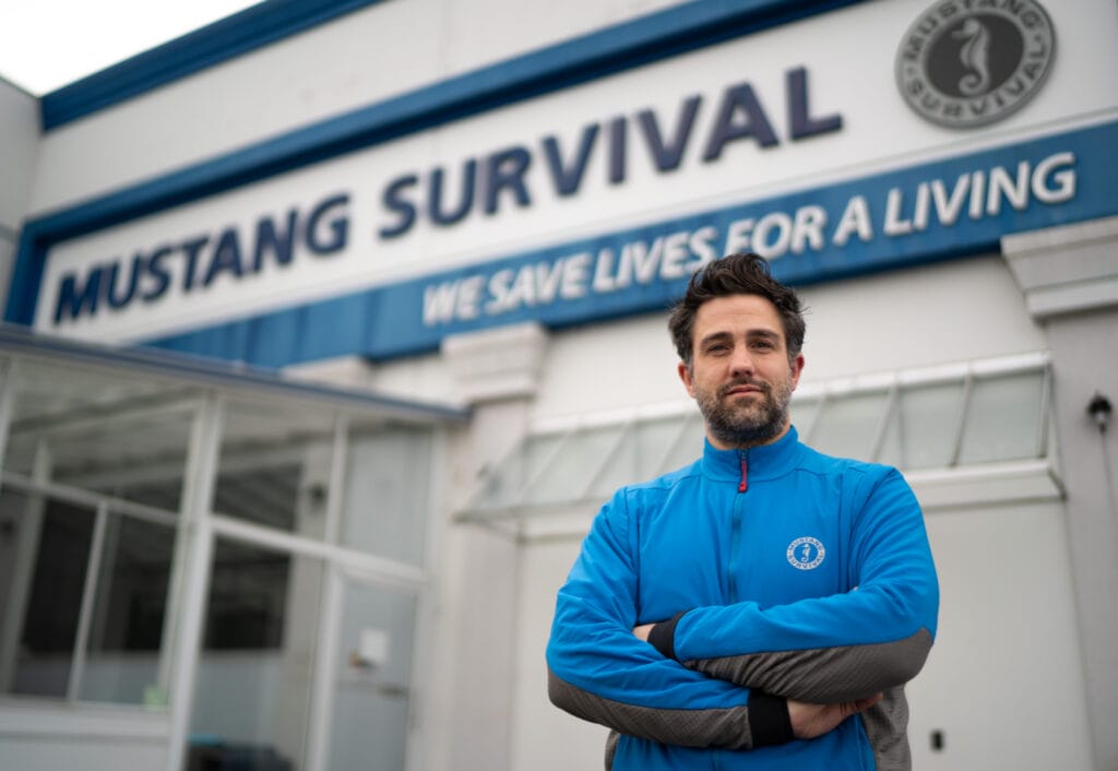 Jason Leggatt under Mustang Survival signage