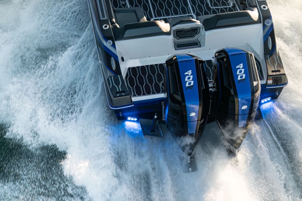 the V-10 400R Mercury outboard on the back of a boat with wake