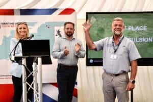 L-R Nikki Dean, Tim Mayer MDL and Steve Bruce ePropulsion at the 2022 GTBS