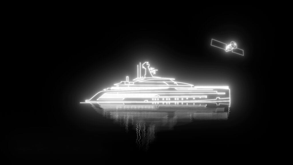 Image of yacht lit up at night