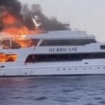 white motor yacht on fire