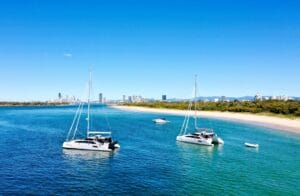 Yachts at anchor with Australian city in background