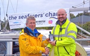 Captain Laurence Kirwan HM Drogheda final HM of challenge presenting Mark with bottle of Aleria Beacon Gin