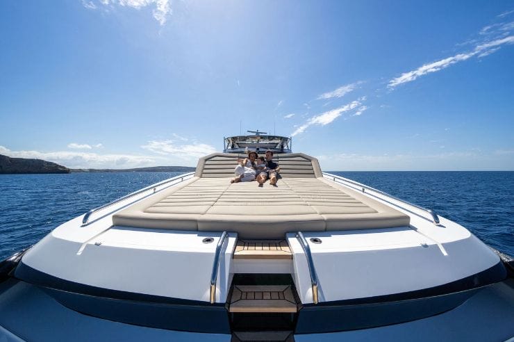 People enjoying sunshine on a boat