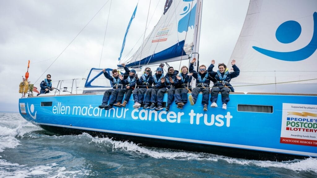 youngsters on sailing boat as it heels