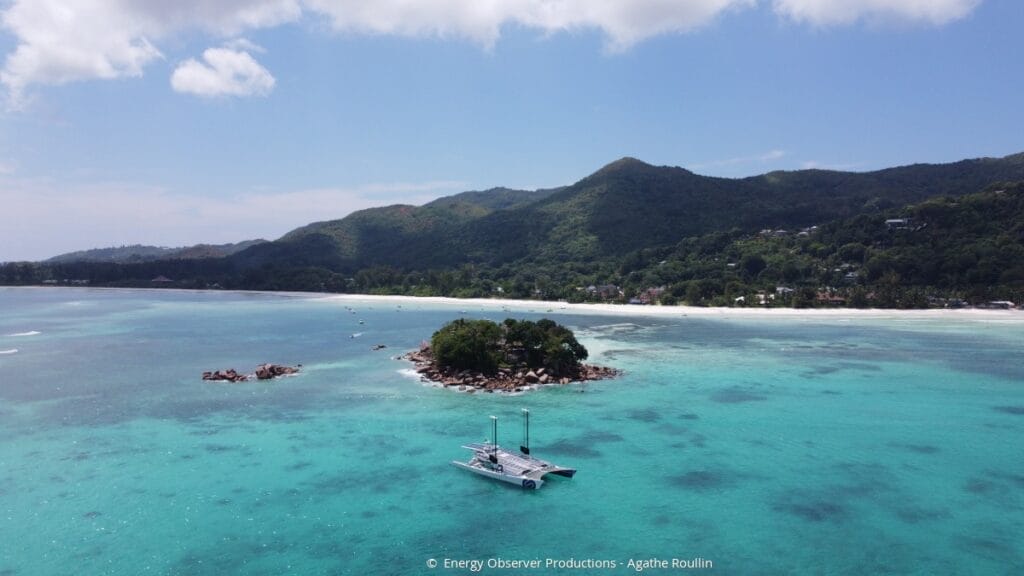 futuristic catamaran anchored off Seychelles beach