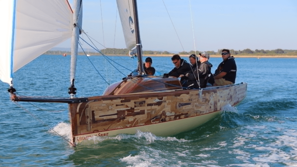 Collective Spirit at sea with group of sailors enjoying the breeze