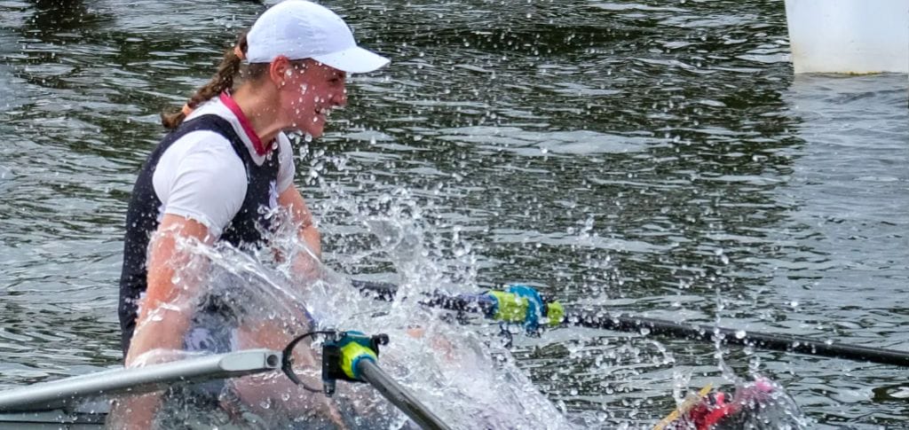 Rower celebrates by splashing water from River Thames. Henley Royal Regatta has issued warning for rowers not to get water into mouths after e-coli test results on Thames