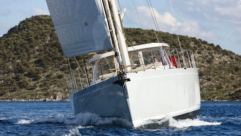 Mishi 88 yacht bow surges through water powered by sail