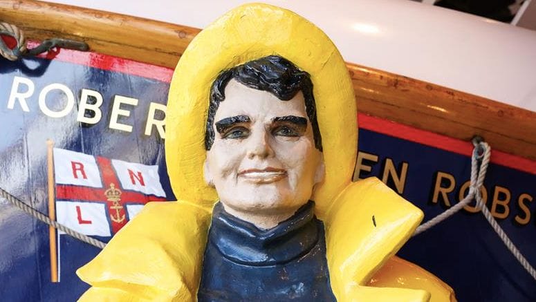 Terrifying figure of man doll in yellow hood