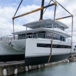 white catamaran being launched
