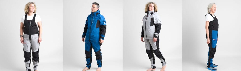 Four men and women modelling inshore sailing trousers and hi-fits