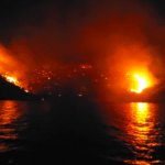 island burns in Greece as suoeryacht crew charged with starting fire with fireworks