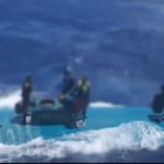 Suspected smugglers aboard submersible in ocean before sinking submersible off Spain