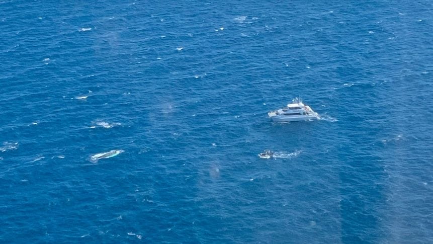 The search and rescue operation involved multiple vessels, police divers and the rescue helicopter. Supplied by RACQ LifeFlight Rescue