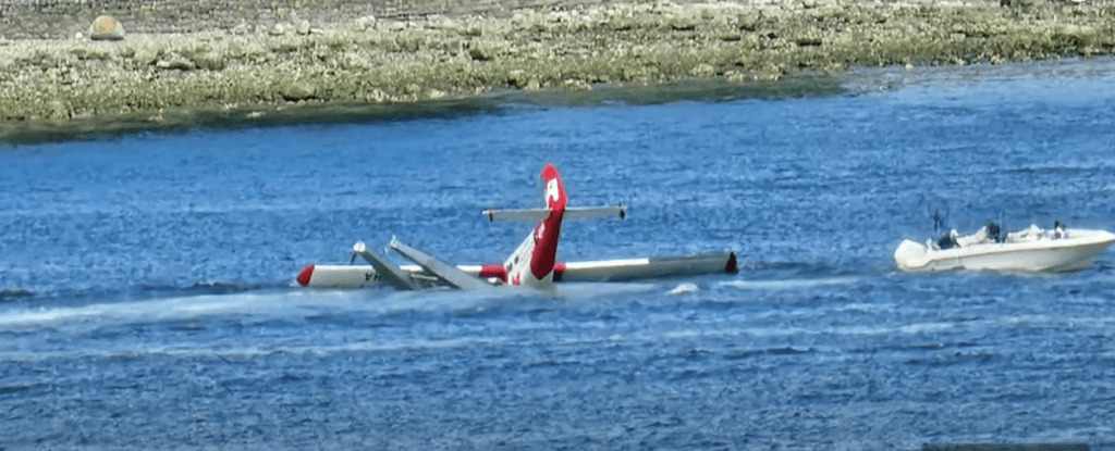 seaplane tail up in water sinking