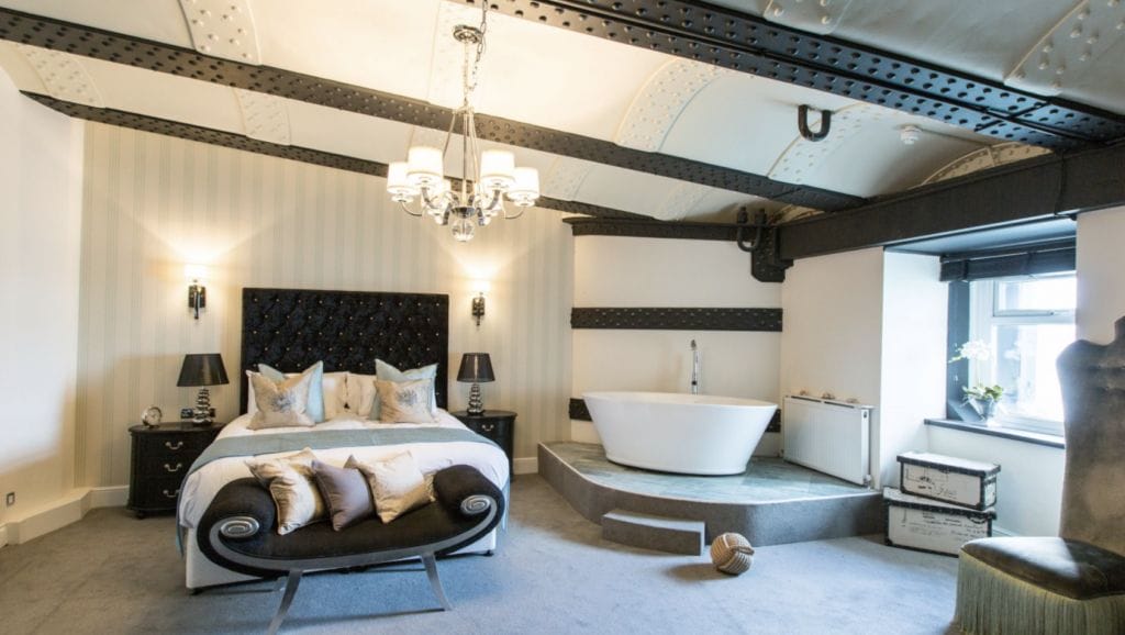 luxury bedroom suite with roll top bath