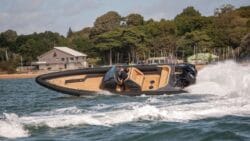 Luxury Rigid inflatable boat banking with wake in the foreground. This is Scorpion RIB boat