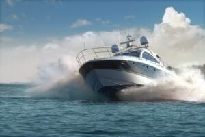 Fast large powerboat bow on with lots of spray