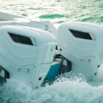 two of Cox Marine diesel outboards on the back of a boat