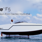 White hydrofoiling boat hovering over the water. The Fibre Boats F5 will be on show at Sydney International Boat Show 2024