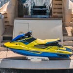 Back of a yacht with a jetski on board