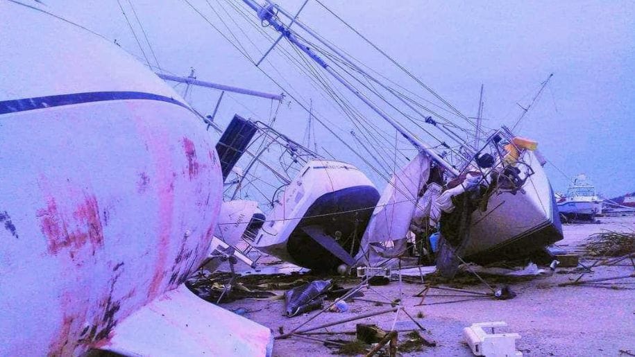 Boats damaged by Hurricane Beryl are flipped on their sides