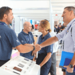 men shake hands at a trade show - it's IBEX