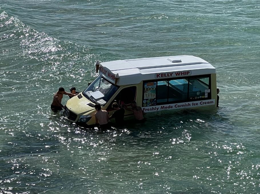 people surround ice cream van swept out to sea in Cornwall