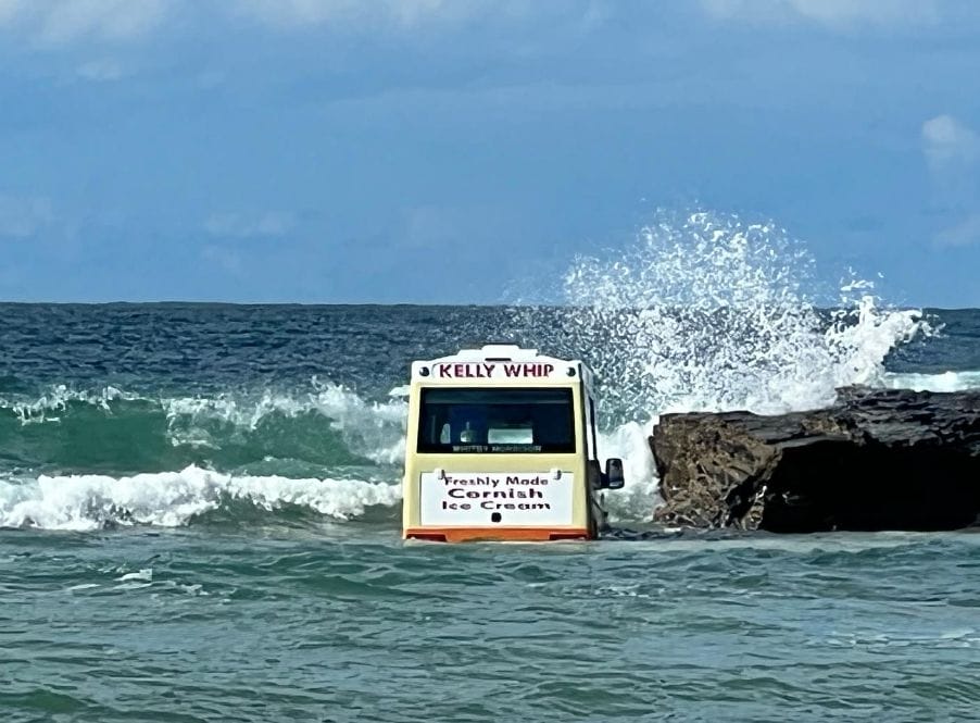 ice cream van swept out to sea in Cornwall on rocks