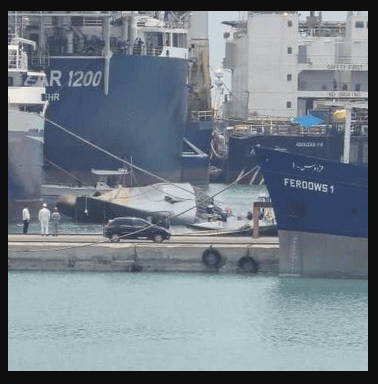 Iranian Navy's Sahand destroyer frigate sinks in Iran port - ship is partially submerged