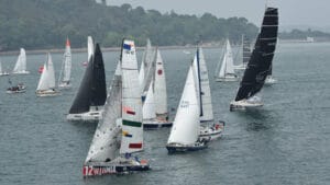 A fleet of yachts, sails full, on the water at the start of the Ostar race . . .a similar fleet to the new Worldstar race?