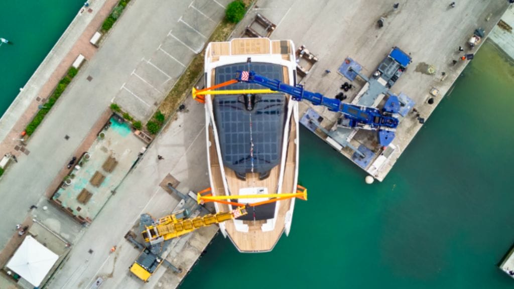 aerial view of WiderCat92 in a cradle being lowered into water