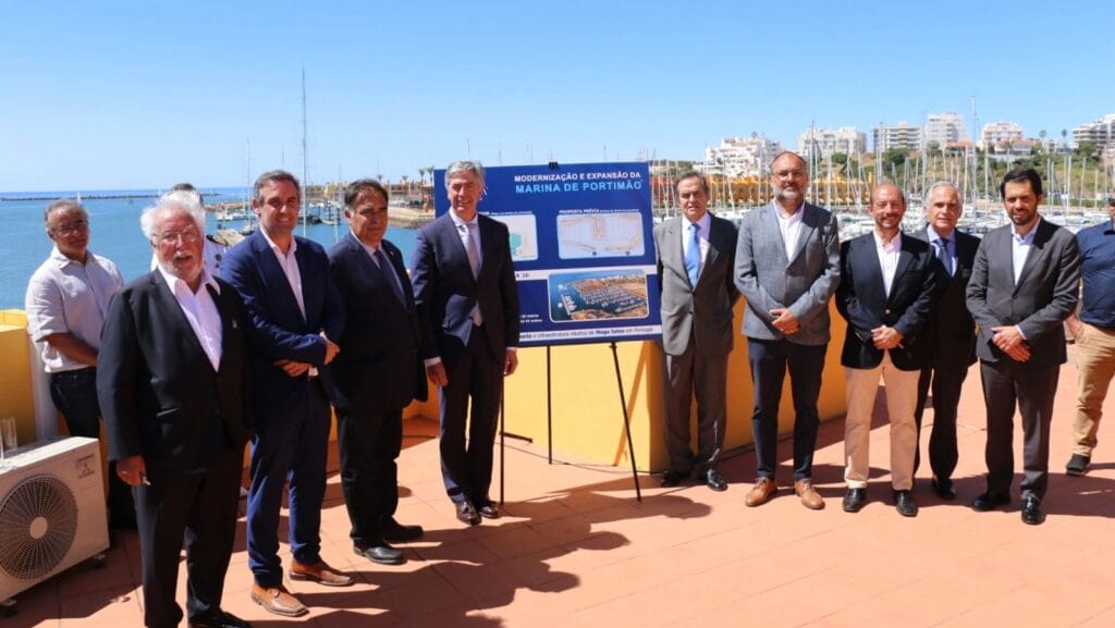 group of delegates with sea in background at portimao marina