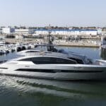 grey and black motor yacht launched in shipyard