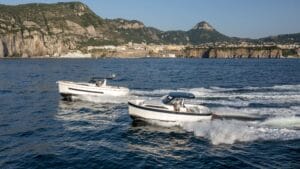 Two of Apreamare gozzo motorboats race across the sea