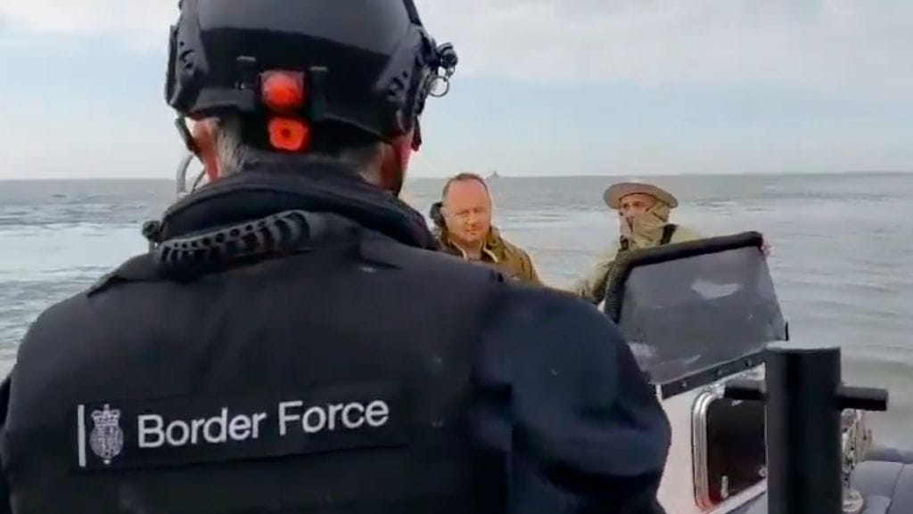 Back of Border Force officer yelling at two men - drug smugglers - on their RHIB before the one in a hat jumps overboard