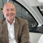 Bryan Jones sitting in interior of Fairline motor yacht