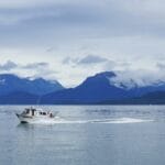 Boat sails on water in Homer, Alaska