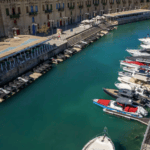 Speed and day boats lined up in a marina - aerial view of boat share club