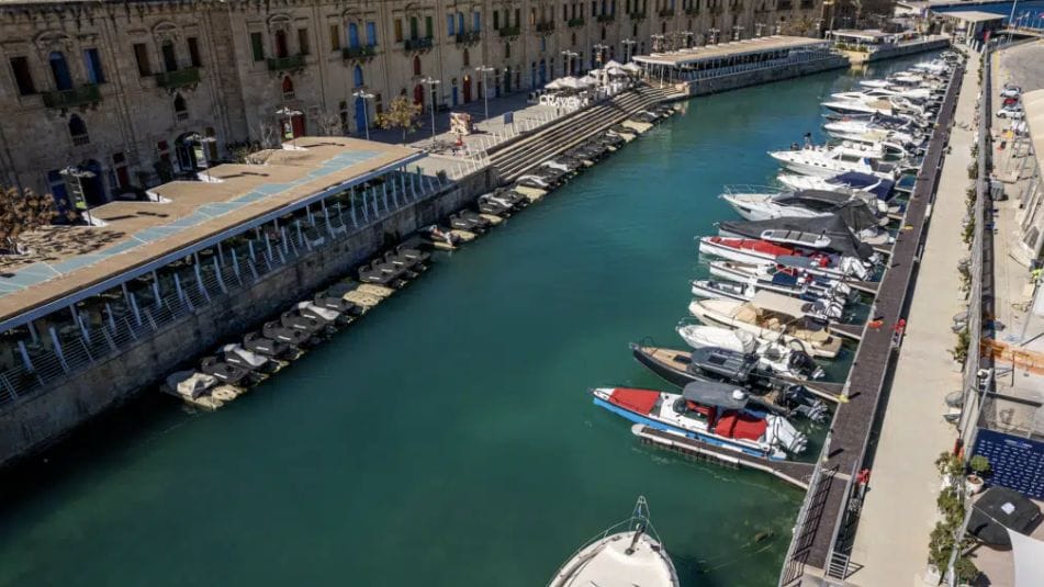 Speed and day boats lined up in a marina - aerial view of boat share club