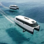 Candela P-12 foiling passenger ferry skimming over tropical water