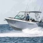 sailfish boats fishing powerboat on the water with wake